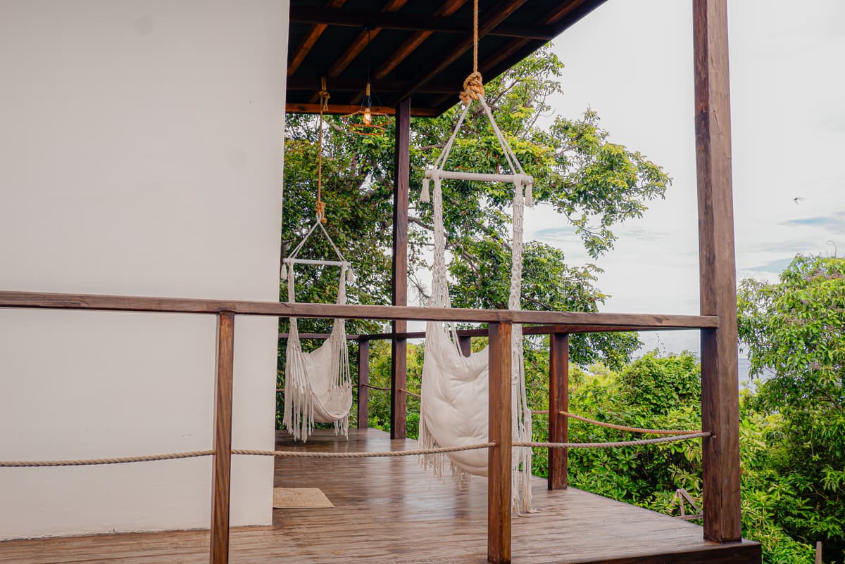 Hammock chairs on the Langkawi terrace among the treetops